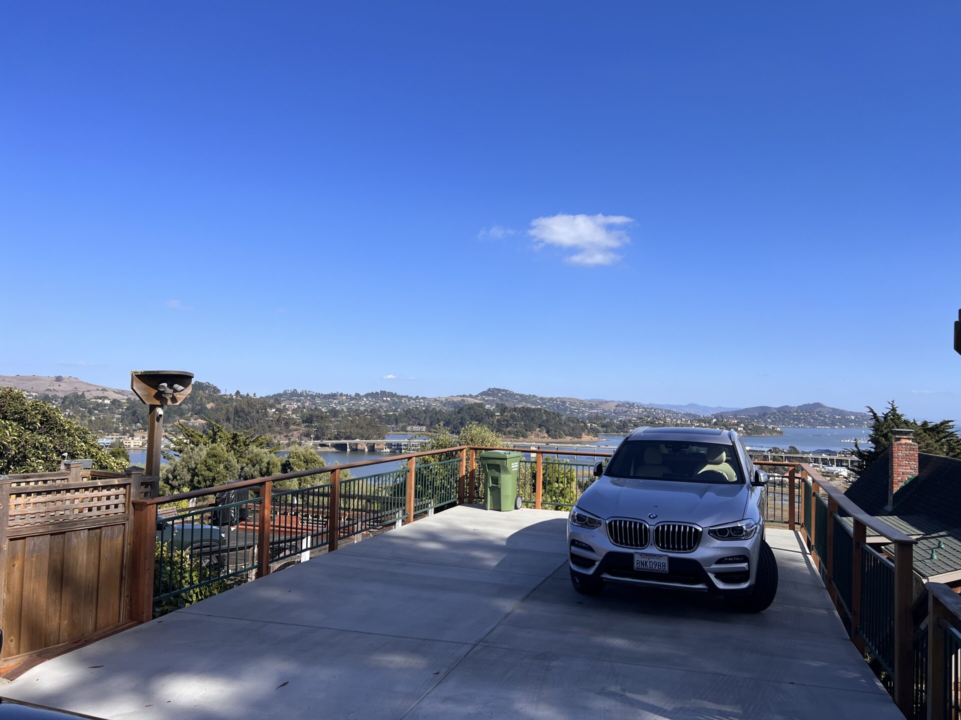 Completed hillside residential parking deck with garage access and wood railing in Marin County.